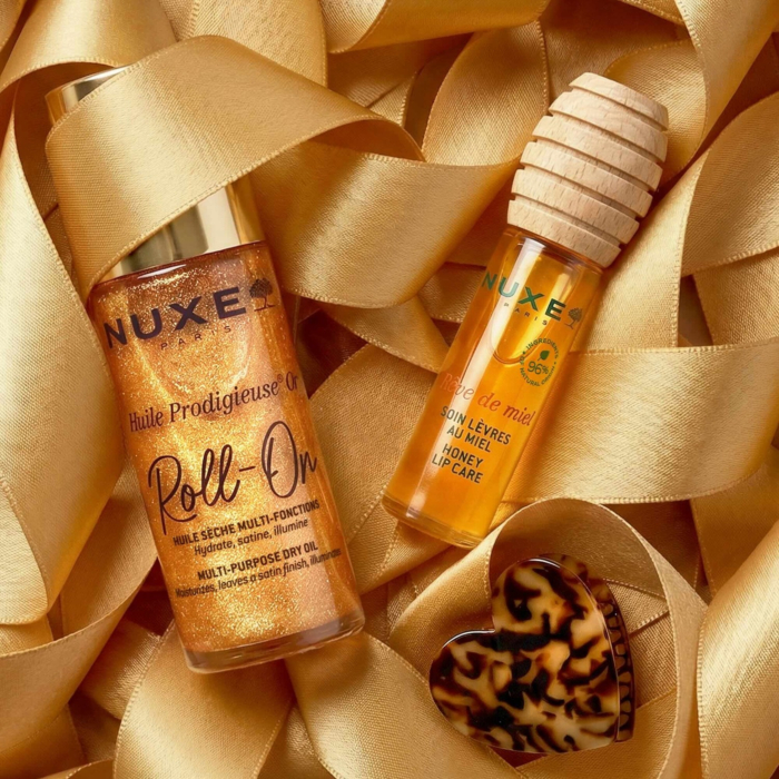 Nuxe Glow Huile Prodigieuse Or: Huile Prodigieuse® OR Roll-on olejek 60ml + Rêve de Miel® Miodowy olejek do ust 10 ml + Spinka do włosów w kształcie serca